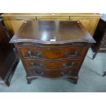 A mahogany serpentine chest of drawers