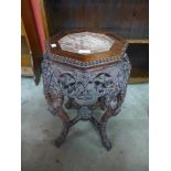 A Chinese marble topped padouk jardiniere stand, 61cms h