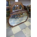 A carved oak octagonal mirror and two others