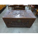An eastern carved camphor-wood blanket box