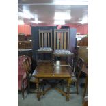 An oak barleytwist draw-leaf table and four chairs