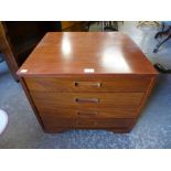 A small teak chest of drawers