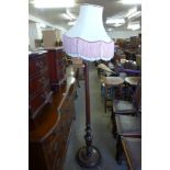 A mahogany standard lamp