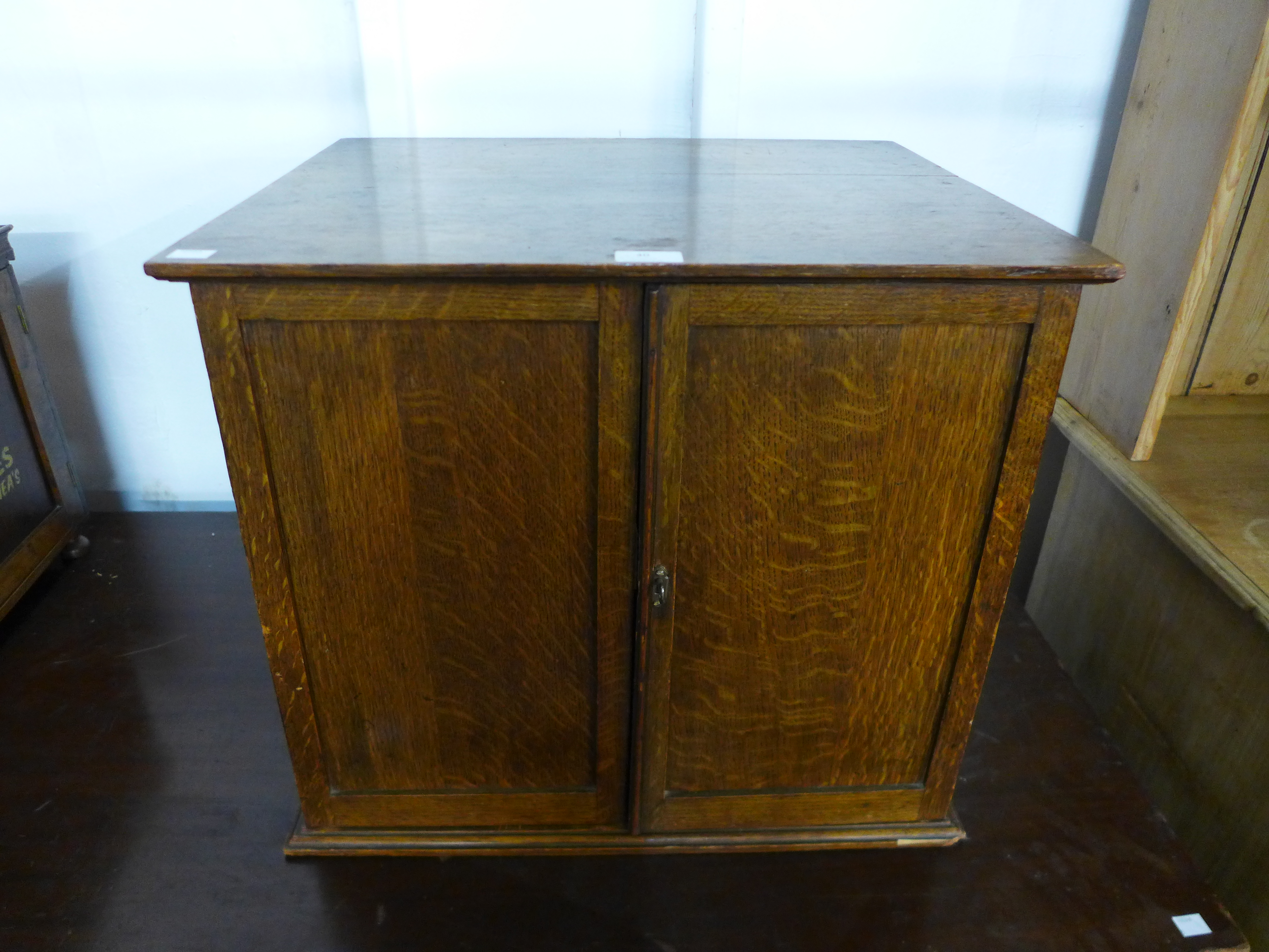 An early 20th Century oak fitted table top cabinet