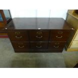 A mahogany six drawer filing cabinet