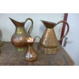 Three copper jugs