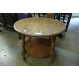 An oak circular occasional table