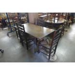 An oak refectory table and four ladderback chairs