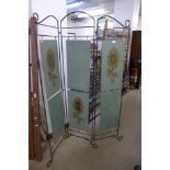 A wrought metal folding screen