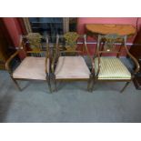 A set of three Sheraton style painted satinwood elbow chairs