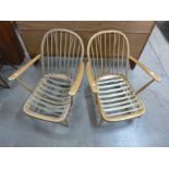 A pair of Ercol Blonde armchairs