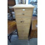 A pine chest of drawers