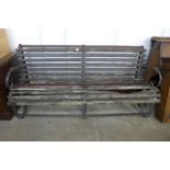 A Victorian wrought iron garden bench