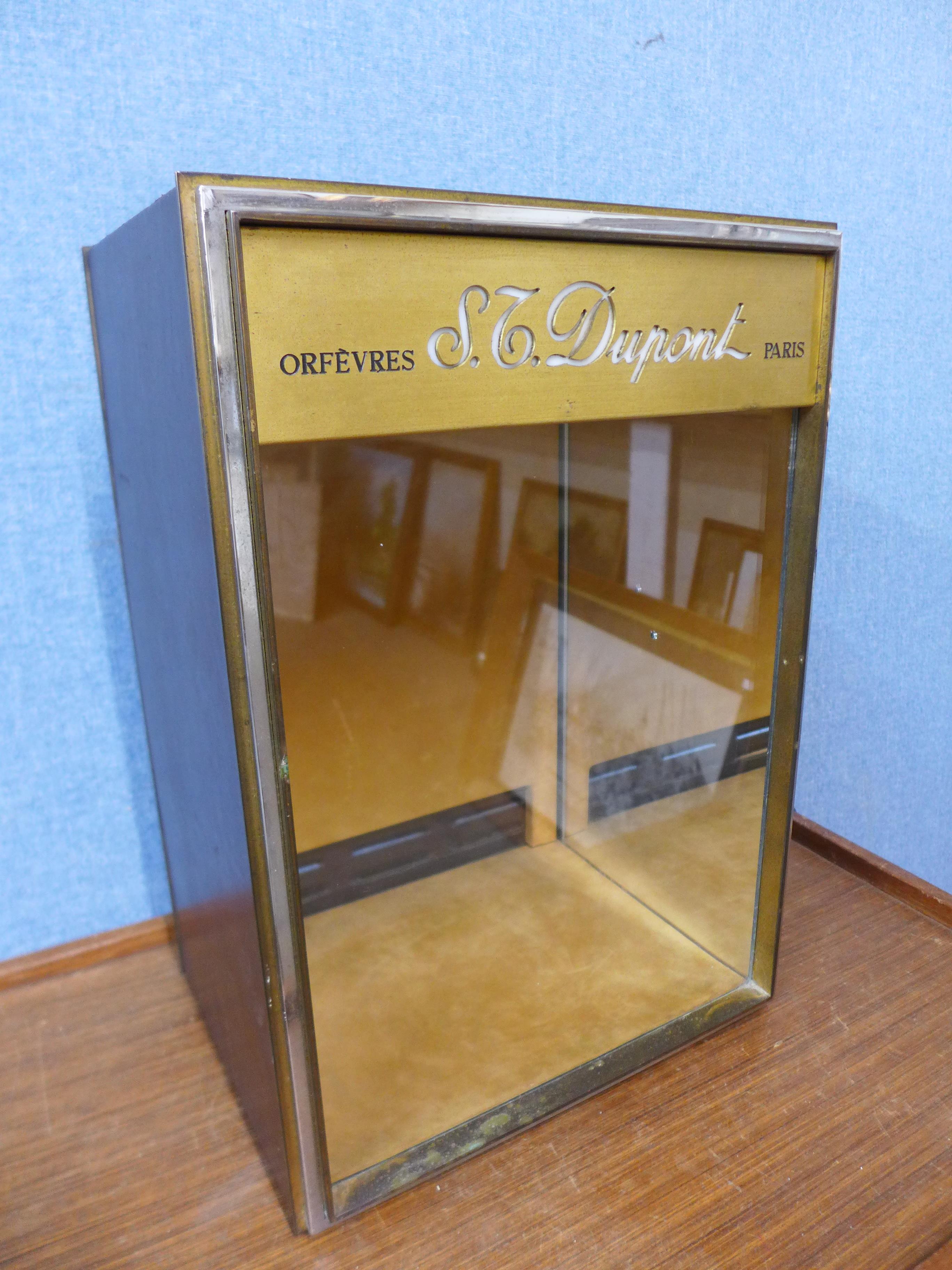 A French S.T. Dupont, Paris illuminated shop display cabinet, 44cms h, 30cms w, 24cms