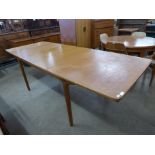 A McIntosh teak double extending dining table