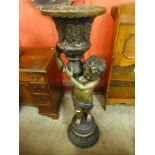 A large French style floor standing bronze cherub vase, 125cms h