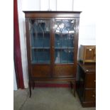 An Edward VII mahogany two door display cabinet