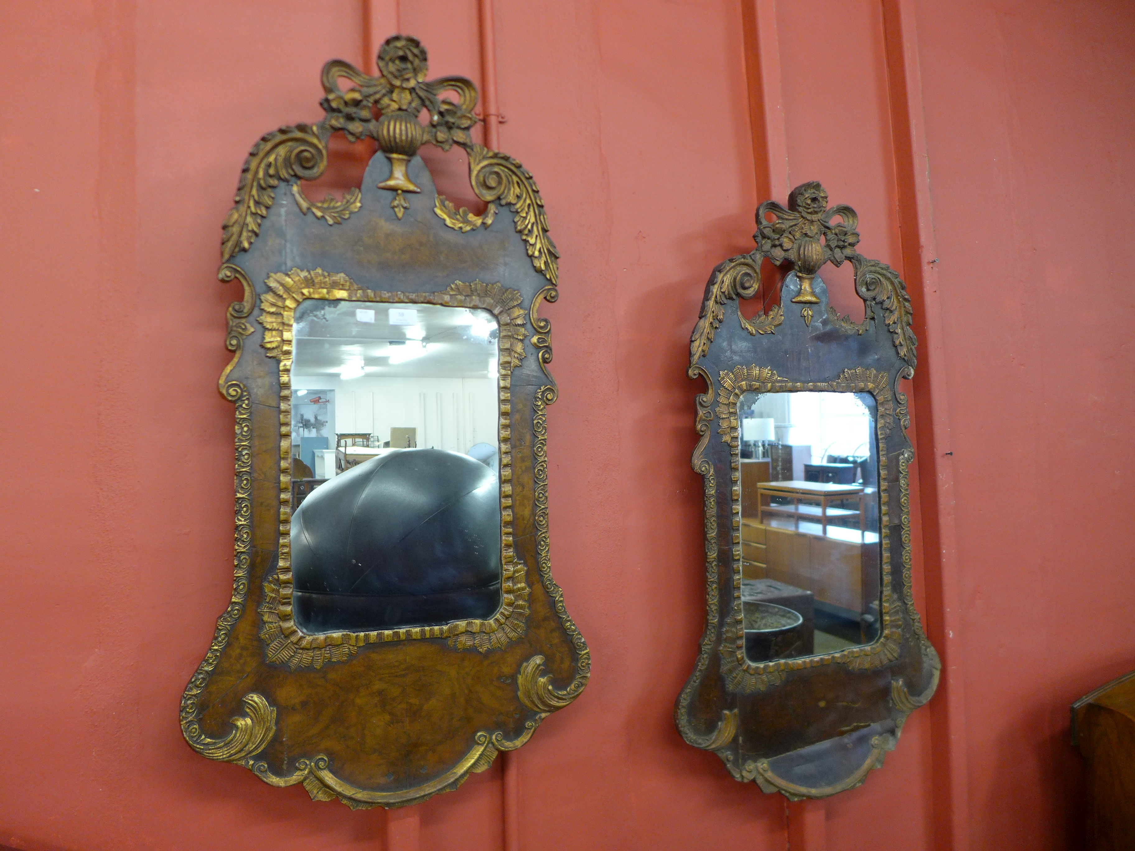 A pair of George I style walnut and parcel gilt framed mirrors, 103cms h