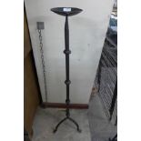 A wrought iron candle stand