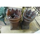 A pair of glazed terracotta chimney pots