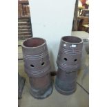 A pair of glazed terracotta chimney pots