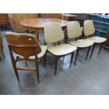 A set of four Elliotts of Newbury teak and vinyl dining chairs