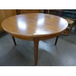 A teak extending dining table