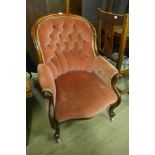 A Victorian mahogany and upholstered armchair