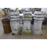 Three Victorian chimney pots and another