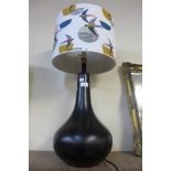 A black ceramic bulbous table lamp