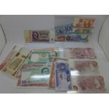 A collection of worldwide banknotes, including GB 10/- x2, Bahamas $3 dollars and others,
