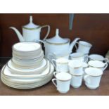 A Spode Golden Eternity dinnerwares and two six-setting tea and coffee sets, teapot a/f