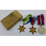 A set of three WWII war medals, boxed