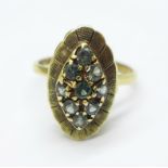 A yellow metal and green stone ring, 2.6g, M