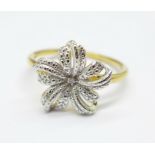 A silver gilt floral ring set with one diamond accent, S