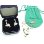 A silver Tiffany & Co. bird necklace and matching earrings