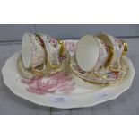 Four Adderley china teacups and saucers and a serving plate