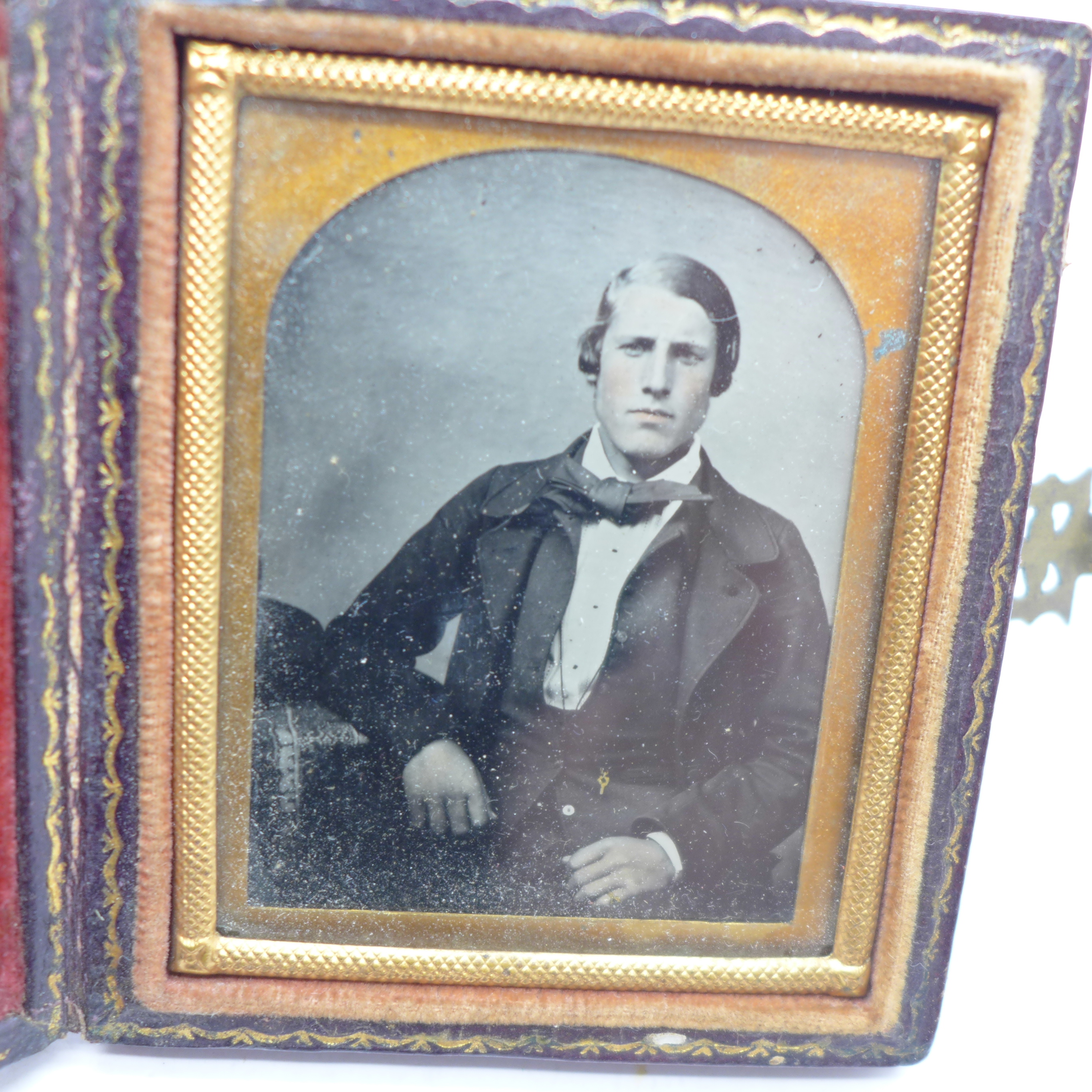 A cased set of six napkin rings and a Victorian photograph, framed - Image 2 of 3