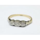 A yellow metal and white metal set three stone diamond ring, 1.8g, L