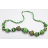 A vintage green marbled glass necklet