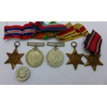 Five WWII medals and a For Loyal Service lapel badge