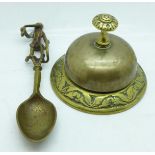 A brass reception/desk bell and a brass monkey spoon