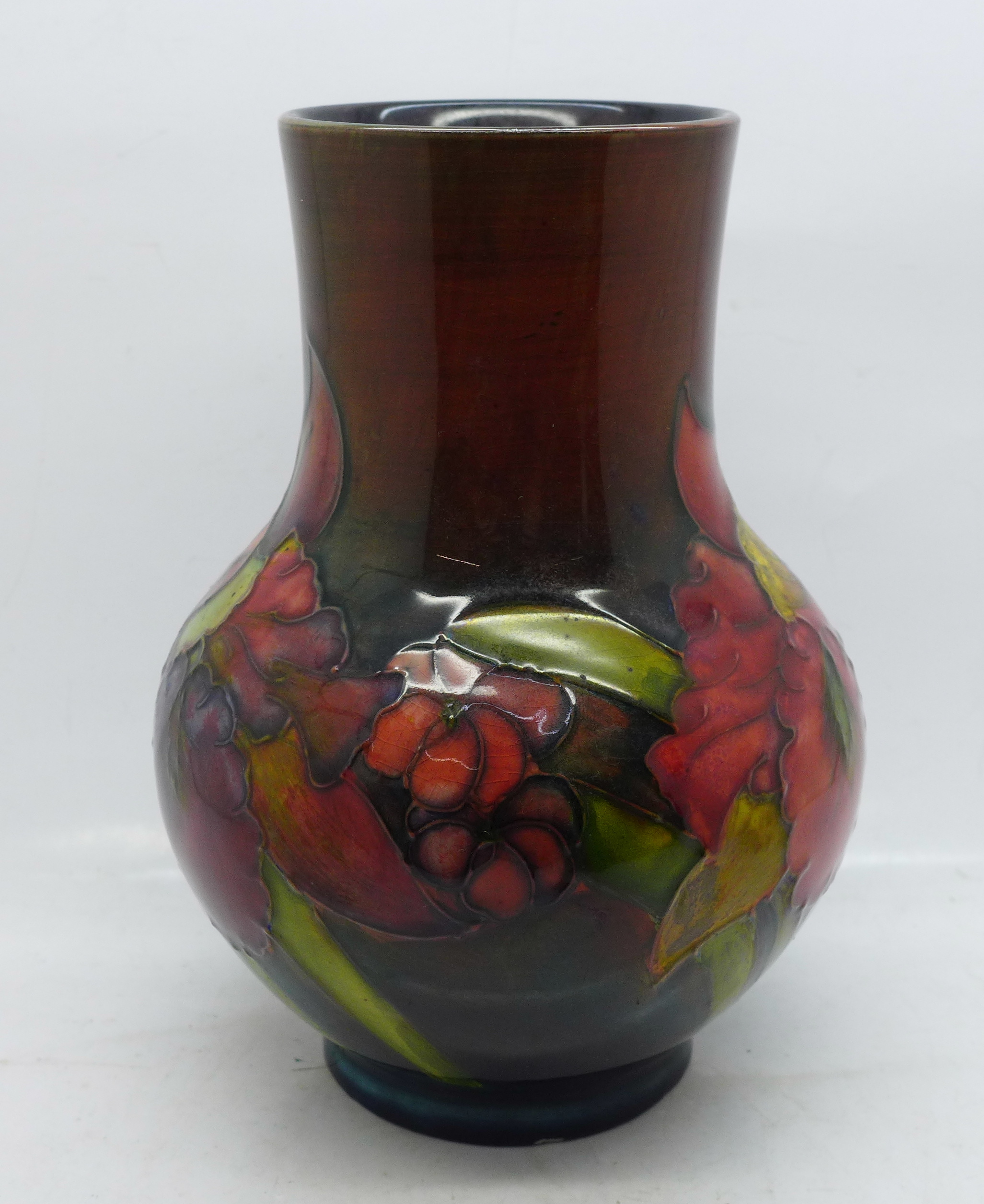 A William Moorcroft Orchid vase, 17.5cm, a/f (small 'nibble' to the base)