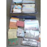 A collection of postcards and photo books