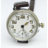 A white metal trench watch, with decorated case back