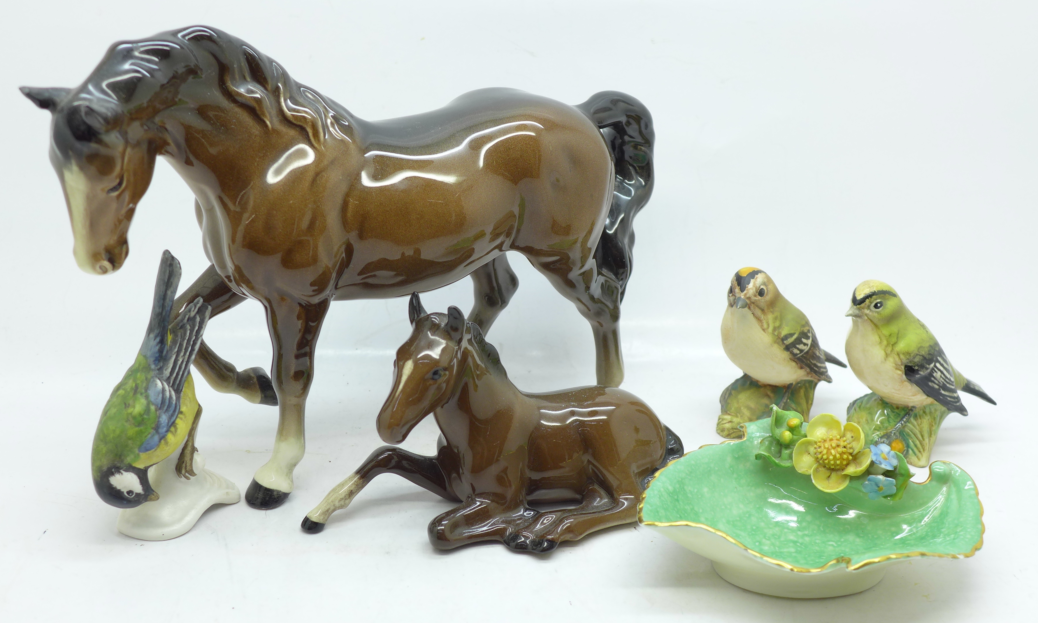 Four Beswick figures comprising two horses and two birds, a Goebel bird figure and a Royal Worcester