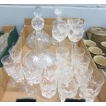 A cylindrical glass decanter marked Waterford and twenty-one assorted matching glasses, (6+5+5+5),