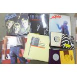 A collection of LP and 45rpm records including The Police, Japan, OMD and Bruce Springsteen