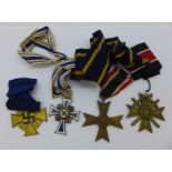 A German Mother's Cross medal and three other German military medals