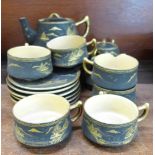 A Japanese tea set with teapot, cream and sugar, one cup a/f